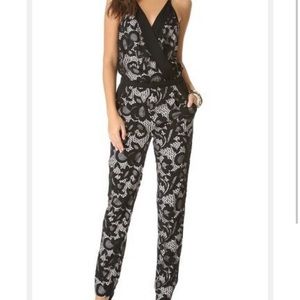 Diane Von Fustenberg black lace and champagne silk vneck jumpsuit. Size 8.